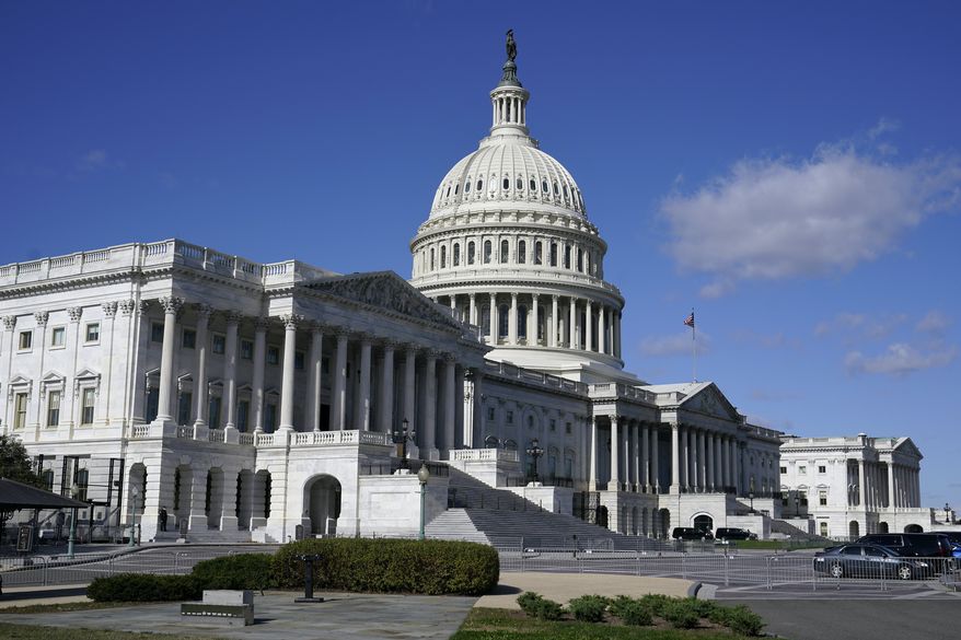 Sunlight shines on the U.S. Capitol building in Washington in this file photo. (AP Photo/Patrick Semansky) ** FILE **
