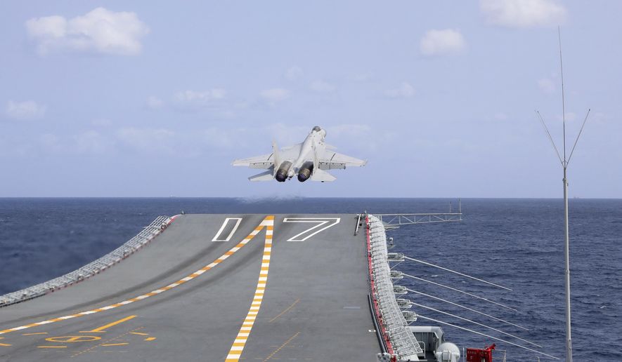 In this photo released by Xinhua News Agency, a J-15 Chinese fighter jet takes off from the Shandong aircraft carrier during the combat readiness patrol and military exercises around the Taiwan Island by the Eastern Theater Command of the Chinese People&#x27;s Liberation Army (PLA) on, April 9, 2023. China’s local maritime authorities have issued a warning for possible rocket debris in waters northeast of Taiwan, saying ships would be banned from entering the area on April 16. The announcement comes after China held large-scale military drills that formally ended Monday in response to Taiwanese President Tsai Ing-wen&#x27;s transit visit last week to the United States. (An Ni/Xinhua via AP, File)
