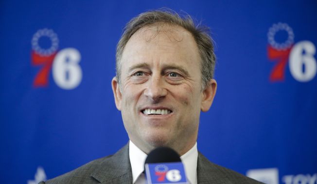 FILE - Philadelphia 76ers owner Josh Harris speaks with members of the media during a news conference at the NBA basketball team&#x27;s practice facility in Camden, N.J., Tuesday, May 14, 2019. A group led by Josh Harris and Mitchell Rales that includes Magic Johnson has an agreement in principle to buy the NFL&#x27;s Washington Commanders from longtime owner Dan Snyder for a North American professional sports team record $6 billion, according to a person with knowledge of the situation. The person spoke to The Associated Press on condition of anonymity Thursday, April 13, 2023, because the deal had not been announced. (AP Photo/Matt Rourke, File)