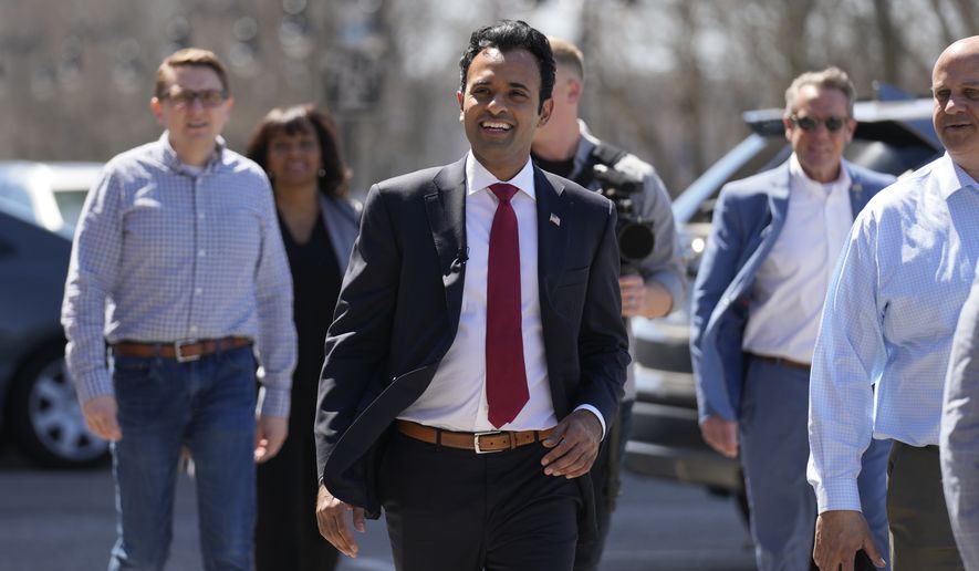 Vivek Ramaswamy, a Republican presidential candidate and businessman, smiles as he arrives for a campaign stop, Thursday, April 13, 2023, in Manchester, N.H. (AP Photo/Charles Krupa)