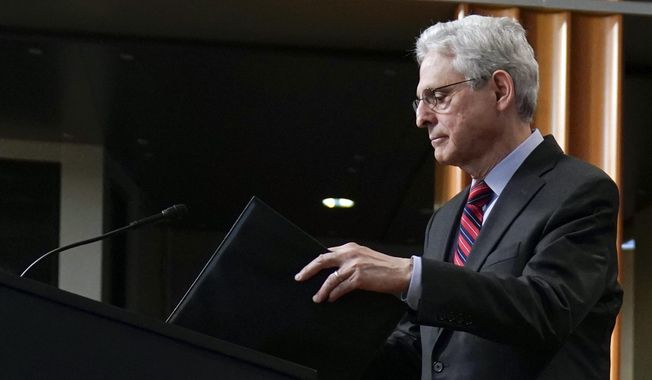Attorney General Merrick Garland arrives to speak at the Department of Justice in Washington, Thursday, April 13, 2023. (AP Photo/Evan Vucci)