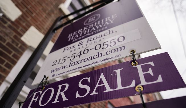 A for sale sign is posted near a home in Philadelphia, Wednesday, Jan. 4, 2023. (AP Photo/Matt Rourke) **FILE**