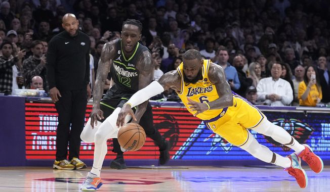 Los Angeles Lakers forward LeBron James (6) dives for the ball against Minnesota Timberwolves forward Taurean Prince (12) during the second half of an NBA basketball play-in tournament game Tuesday, April 11, 2023, in Los Angeles. (AP Photo/Marcio Jose Sanchez)