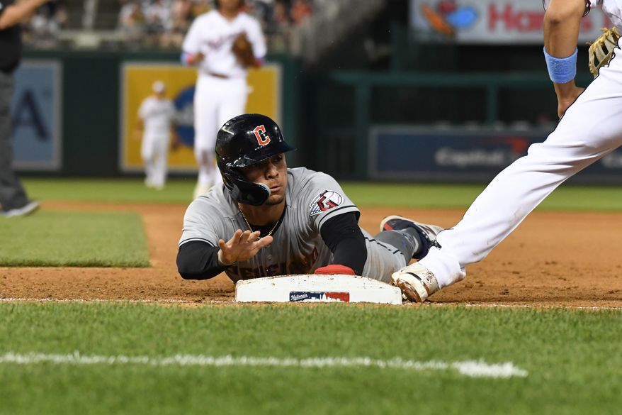 Cleveland Guardians second baseman Andres Gimenez (0) diving back to the bag during an MLB game against the Washington Nationals at Nationals Park in Washington D.C., April 14, 2023. (Photo by Billy Sabatini/All-Pro Reels)