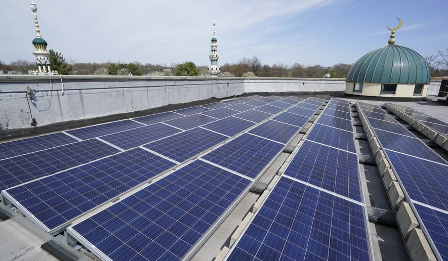 Solar panels cover the roof of Masjid Al-Wali, a mosque in Edison, N.J., Tuesday, April 11, 2023. (AP Photo/Seth Wenig)