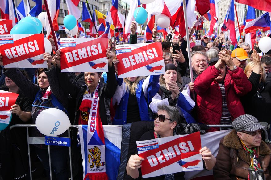 People shout slogans as thousands of people gather to protest high inflation and to demand the government's resignation in Prague, Czech Republic, Sunday, April 16, 2023. (AP Photo/Petr David Josek)