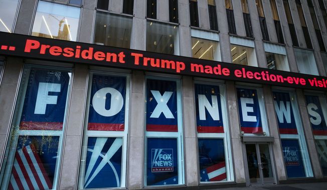 A headline about President Donald Trump is displayed outside Fox News studios in New York on Nov. 28, 2018. Dominion Voting Systems&#x27; defamation lawsuit against Fox News for airing bogus allegations of fraud in the 2020 election is set to begin trial on Monday, April 17, 2023, in Delaware. (AP Photo/Mark Lennihan, File)