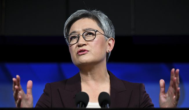 Australian Foreign Minister Penny Wong addresses the National Press Club in Canberra, Monday, April 17, 2023. Australia was working to stabilize relations with China but could not return to the thriving economic relationship with its biggest trading partner that existed 15 years ago, Wong said. (Lukas Coch/AAP Image via AP)