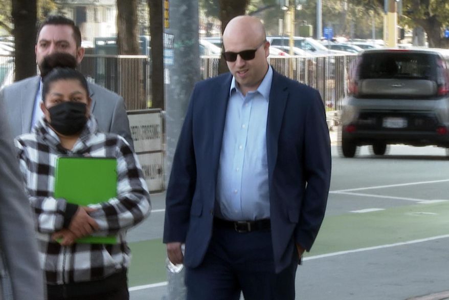 Santa Clara City Councilmember Anthony Becker walks to the Hall of Justice for a court appearance in San Jose, Calif., Monday, April 17, 2023. Becker deferred his pleas on criminal charges for allegedly lying about leaking a grand jury report on the San Francisco 49ers' political influence and relationships with the city's elected officials. Becker will next appear in court on May 3, 2023, and he remains out of custody in the meantime. (AP Photo/Terry Chea)