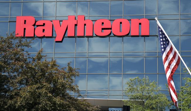 An American flag flies in front of the facade of Raytheon&#x27;s Integrated Defense Systems facility in Woburn, Mass., June 10, 2019. China revealed new details of sanctions it previously announced against two U.S. weapons manufacturers, Lockheed Martin and Raytheon Technologies Corp.’s Raytheon Missiles &amp; Defense, Tuesday, April 18, 2023, including a ban on Chinese companies doing business with them. (AP Photo/Elise Amendola, File)
