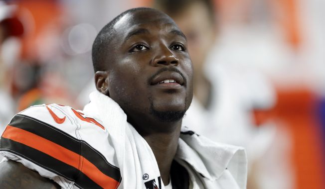 Cleveland Browns defensive end Chris Smith sits on the sideline during the first half of an NFL preseason football game against the Washington Redskins in Cleveland, Aug. 8, 2019. Former NFL defensive end Chris Smith, who was touched by tragedy while he played for the Cleveland Browns, has died. He was 31. Smith&#x27;s agent, Drew Rosenhaus, and the Browns confirmed his passing Tuesday, April 18, 2023. (AP Photo/Ron Schwane, File)