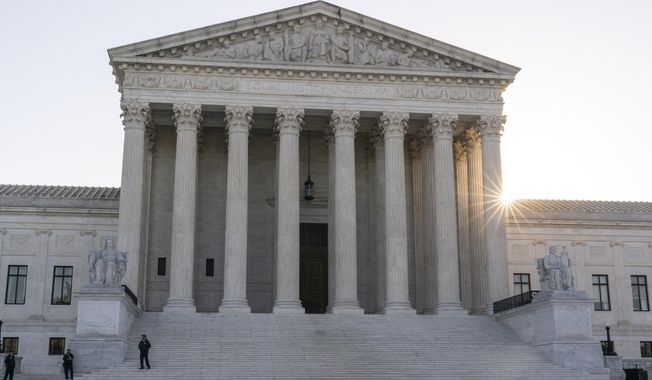 The sun rises behind the U.S. Supreme Court, Oct. 11, 2022, in Washington. The Supreme Court says New Jersey can withdraw from a commission the state created decades ago with New York to combat the mob&#x27;s influence at their joint port. The high court ruled unanimously on April 18, 2023, that the Garden State doesn&#x27;t need New York&#x27;s consent to withdraw from the Waterfront Commission of New York Harbor. (AP Photo/Alex Brandon, File)