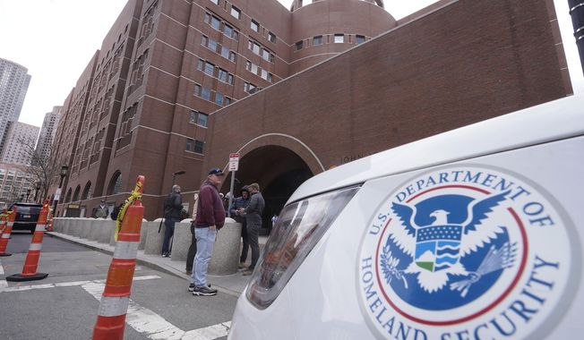 A Homeland Security vehicle, right, is parked outside the Moakley Federal Courthouse, Wednesday, April 19, 2023, in Boston. Jack Teixeira, the Massachusetts Air National Guardsman charged with leaking highly classified military documents, made a brief appearance in federal court Wednesday, but a hearing to determine whether he should remain jailed while awaiting trial has been delayed to give the defense more time to prepare. (AP Photo/Steven Senne)