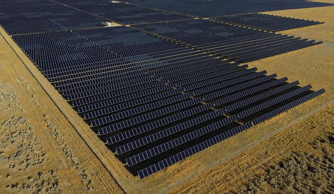 FILE - A solar farm sits in Mona, Utah, on Tuesday, Aug. 9, 2022. The Biden administration is announcing Thursday, April 20, 2023, more than $80 million in funding as part of a push to make more solar panels in the U.S. and make solar energy available in more communities. (AP Photo/Rick Bowmer, File)