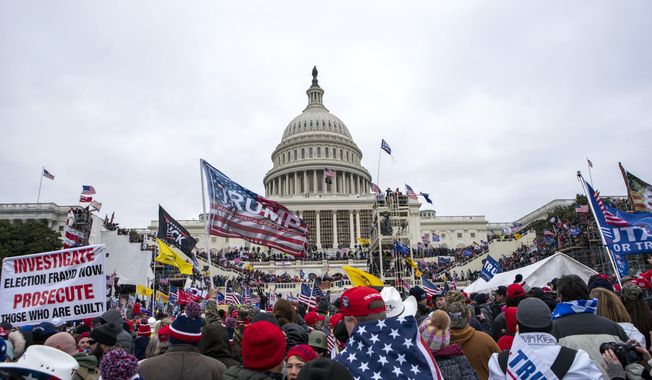 Rioters loyal to President Donald Trump rally at the U.S. Capitol on Jan. 6, 2021, in Washington. (AP Photo/Jose Luis Magana, File)