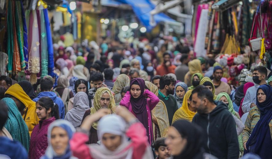 Kashmiri Muslims shop ahead of Eid al-Fitr in Srinagar, Indian controlled Kashmir, Tuesday, April 18, 2023. Eid al-Fitr, marks the end of the fasting month of Ramadan. (AP Photo/Mukhtar Khan)