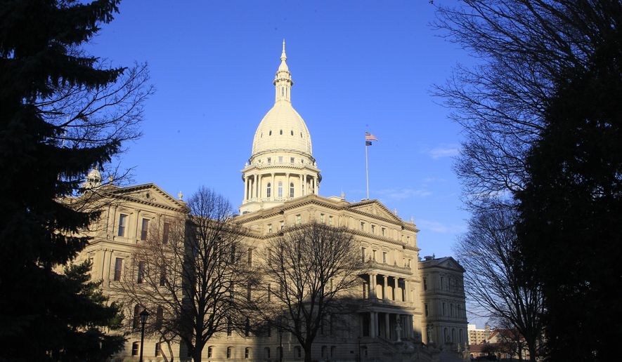 The state Capitol building stands on Dec. 12, 2012, in Lansing, Mich. A Michigan Senate committee gave final legislative approval Thursday, April 20, 2023, to allocate $175 million in state funds to a factory planned by Chinese manufacturer Gotion in northern Michigan that proponents say will create thousands of jobs and be a boon for the local economy. (AP Photo/Carlos Osorio, File)
