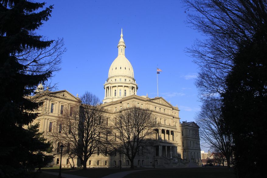 The state Capitol building stands on Dec. 12, 2012, in Lansing, Mich. A Michigan Senate committee gave final legislative approval Thursday, April 20, 2023, to allocate $175 million in state funds to a factory planned by Chinese manufacturer Gotion in northern Michigan that proponents say will create thousands of jobs and be a boon for the local economy. (AP Photo/Carlos Osorio, File)