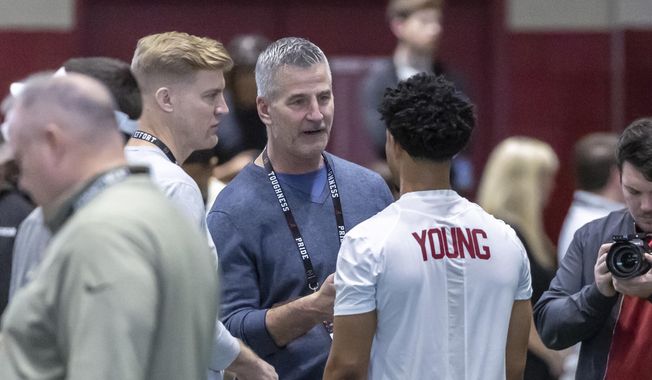 Carolina Panthers head football coach Frank Reich talks with former Alabama quarterback Bryce Young at Alabama&#x27;s NFL pro day, Thursday, March 23, 2023, in Tuscaloosa, Ala. The Panthers packaged two first-round picks, two second-round picks and star receiver D.J. Moore to move up from No. 9 in the draft to the top pick to give Carolina the pick of the lot at quarterback in next week&#x27;s draft. (AP Photo/Vasha Hunt, File)