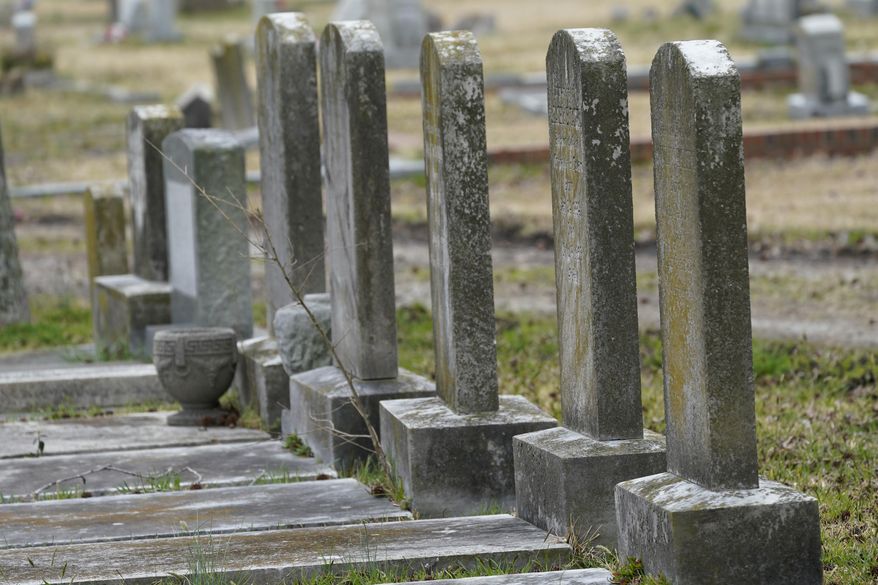 Tombstones mark graves at the Lincoln Memorial Cemetery in Portsmouth, Va., Tuesday, March 23, 2021. The longstanding racial gap in U.S. stroke death rates widened dramatically during the COVID-19 pandemic, new research suggests. Stroke death rates increased for both Black and White adults in 2020 and 2021, according to a study released by the Centers for Disease Control and Prevention on Thursday, April 20, 2023. But the difference between the two groups grew about 22%, compared to the five years before the pandemic. (AP Photo/Steve Helber) **FILE**