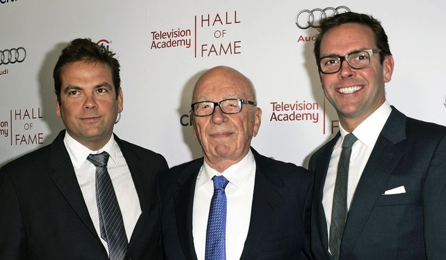 News Corp. Executive Chairman Rupert Murdoch, center, and his sons, Lachlan, left, and James Murdoch attend the 2014 Television Academy Hall of Fame in Beverly Hills, Calif., on March 11, 2014. Fox Corp. chief executive Lachlan Murdoch on Friday, April 21, 2023, dropped his defamation lawsuit against Australian news website Crikey, citing the Fox News settlement of a U.S. court case where the network agreed to pay almost $800 million over its lies involving the 2020 U.S. presidential election. (Photo by Dan Steinberg/Invision/AP Images, File)