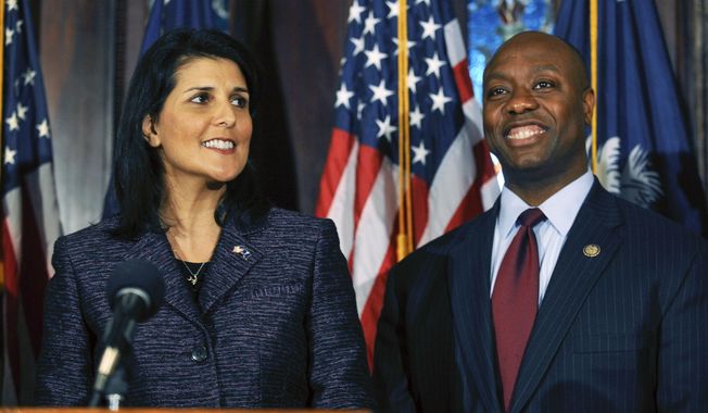 South Carolina Gov. Nikki Haley, left, announces Rep. Tim Scott, right, as Sen. Jim DeMint&#x27;s replacement in the U.S. Senate during a news conference at the South Carolina Statehouse, Dec. 17, 2012, in Columbia, S.C. Haley and Scott are forever linked by that announcement, cementing their status as rising stars in a Republican Party frustrated by Barack Obama&#x27;s reelection just a month earlier. But nearly a dozen years later, they find themselves poised to run against each other for the GOP presidential nomination. Haley has already launched a campaign, and Scott took steps last week toward initiating a bid of his own. (AP Photo/Rainier Ehrhardt, File)