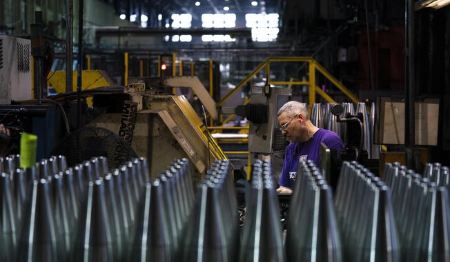 A steel worker manufactures 155 mm M795 artillery projectiles at the Scranton Army Ammunition Plant in Scranton, Pa., Thursday, April 13, 2023. One of the most important munitions of the Ukraine war comes from a historic factory in this city built by coal barons, where tons of steel rods are brought in by train to be forged into the artillery shells Kyiv can’t get enough of — and that the U.S. can’t produce fast enough. (AP Photo/Matt Rourke)