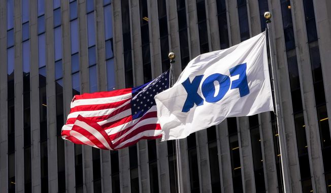 The American and Fox flags fly outside the News Corp. and Fox News headquarters on Wednesday, April 19, 2023, in New York. Fox Corp.&#x27;s hefty $787.5 million settlement with Dominion over defamation charges is unlikely to make a dent in Fox&#x27;s operations, analysts say. (AP Photo/Mary Altaffer, File)