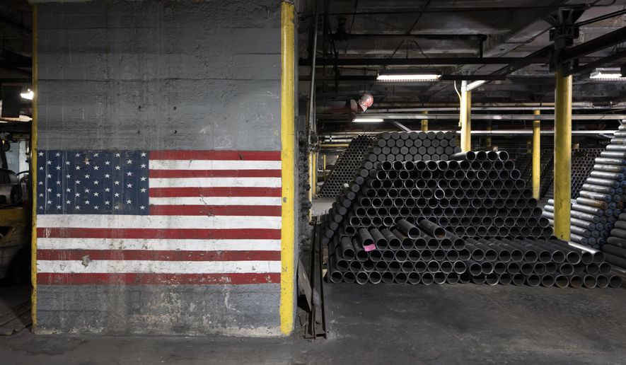 155 mm M795 artillery projectiles are stacked during manufacturing process at the Scranton Army Ammunition Plant in Scranton, Pa., Thursday, April 13, 2023. The 155 mm howitzer round is one of the most requested artillery munitions of the Ukraine war. Already the U.S. has shipped more than 1.5 million rounds to Ukraine, but Kyiv is still seeking more. (AP Photo/Matt Rourke)