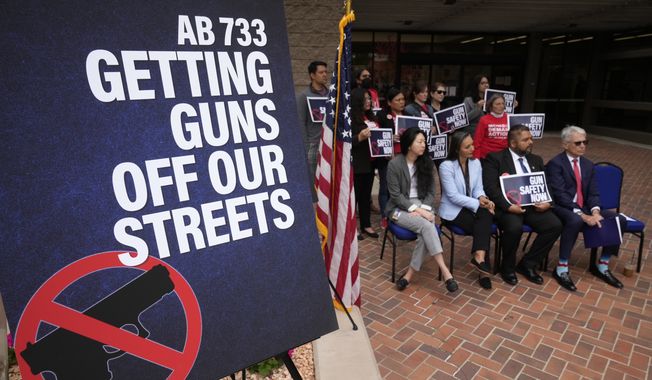 Lawmakers, prosecutors and survivors attend a news conference announcing three new laws aimed at getting guns off California streets in Monterey Park, Calif., Monday, April 24, 2023. (AP Photo/Damian Dovarganes)