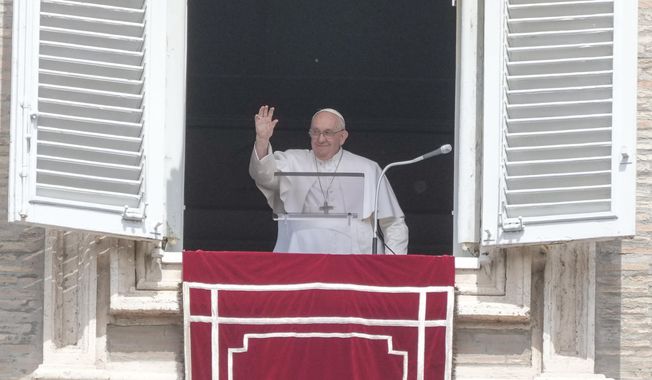 Pope Francis waves to faithful as he celebrates the Reigna Coeli noon prayer in St. Peter&#x27;s Square at the Vatican, Sunday, April 23, 2023. (AP Photo/Gregorio Borgia)