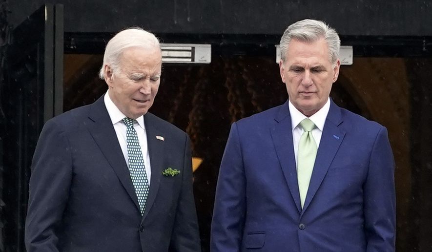 President Joe Biden talks with House Speaker Kevin McCarthy, R-Calif., as he departs the Capitol following the annual St. Patrick&#x27;s Day gathering, in Washington, March 17, 2023. There are stark differences in how President Joe Biden and House Speaker Kevin McCarthy want to shore up the government&#x27;s finances.  The Democratic president primarily wants higher taxes on the wealthy to lower deficits; the GOP congressional leader favors sharp spending cuts. (AP Photo/J. Scott Applewhite) **FILE**