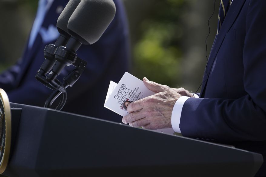 President Joe Biden looks at notes during a news conference with South Korea's President Yoon Suk Yeol in the Rose Garden of the White House on Wednesday, April 26, 2023, in Washington. (AP Photo/Evan Vucci)