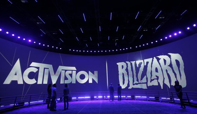 The Activision Blizzard Booth during the Electronic Entertainment Expo in Los Angeles, June 13, 2013. British regulators have blocked Microsoft&#x27;s $69 billion deal to buy videogame maker Activision Blizzard over worries that it would stifle competition in the cloud gaming market.. (AP Photo/Jae C. Hong, File)