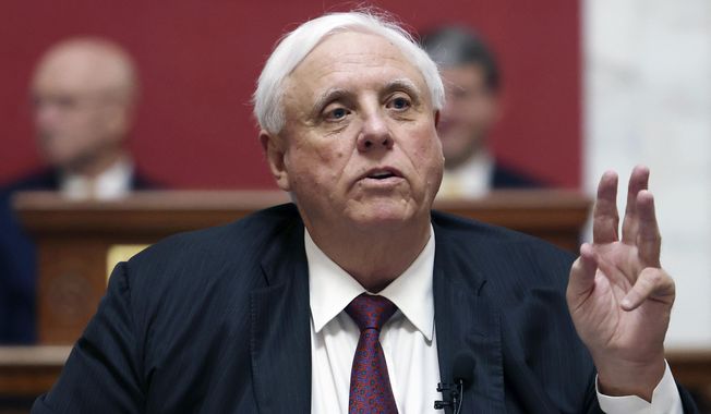 West Virginia Gov. Jim Justice delivers his annual State of the State address in the House Chambers at the West Virginia Capitol in Charleston, W.Va., Jan. 11, 2023. Justice is set to make an announcement Thursday, April 27, ending speculation about whether he will seek the U.S. Senate seat currently held by Democrat Joe Manchin. (AP Photo/Chris Jackson) **FILE**