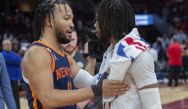 New York Knicks&#x27; Jalen Brunson (11) talks with Cleveland Cavaliers&#x27; Darius Garland (10) after the Knicks&#x27; 106-95 win in Game 5 of an NBA basketball first-round playoff series Wednesday, April 26, 2023, in Cleveland. The Knicks won the series. (AP Photo/Phil Long)