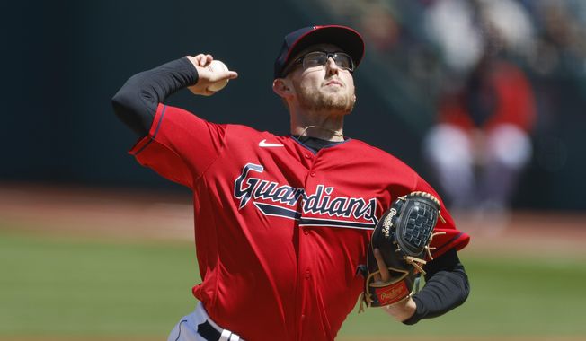 Cleveland Guardians starting pitcher Tanner Bibee throws in his major league debut against the Colorado Rockies during the first inning of a baseball game, Wednesday, April 26, 2023, in Cleveland. (AP Photo/Ron Schwane)