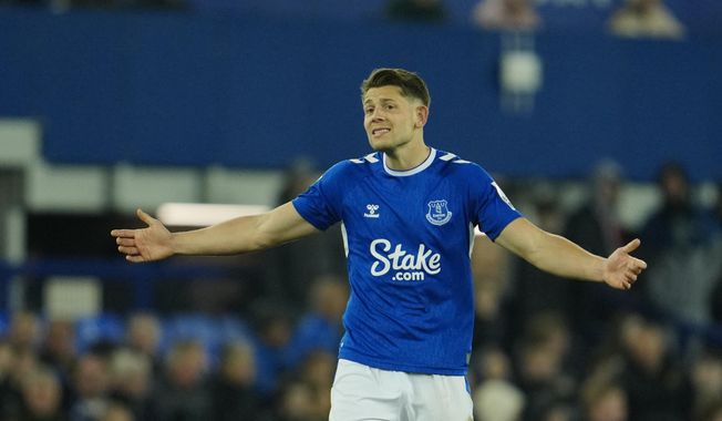 Everton&#x27;s James Tarkowski reacts after Newcastle&#x27;s side&#x27;s fourth goal during the English Premier League soccer match between Everton and Newcastle United at the Goodison Park stadium in Liverpool, England, Thursday, April 27, 2023. (AP Photo/Jon Super)