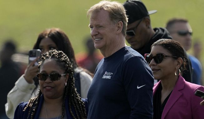 NFL commissioner Roger Goodell watches a Play Football clinic ahead of the NFL draft Wednesday, April 26, 2023, at Center High School in Kansas City, Mo. The draft will run from April 27-29. (AP Photo/Charlie Riedel)