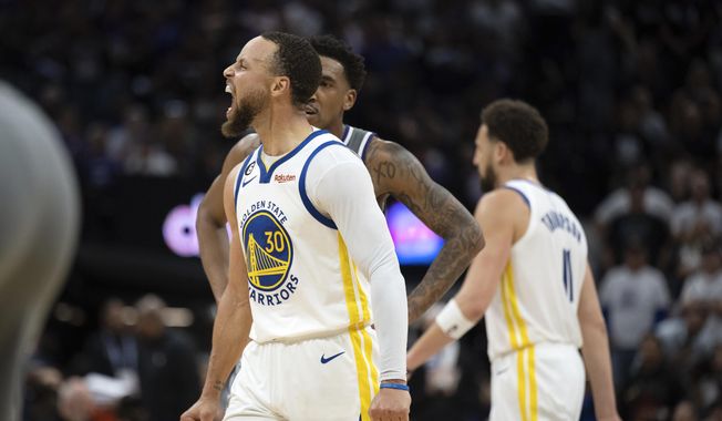 Golden State Warriors guard Stephen Curry (30) lets out a scream after making a basket against the Sacramento Kings during the second half of Game 5 of an NBA basketball first-round playoff series Wednesday, April 26, 2023, in Sacramento, Calif. (AP Photo/José Luis Villegas)
