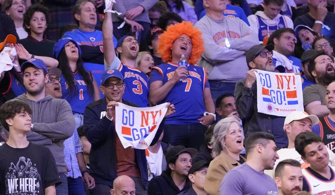 New York Knicks fans cheer in the second half of Game 4 in an NBA basketball first-round playoff series against the Cleveland Cavaliers, Sunday, April 23, 2023, at Madison Square Garden in New York. The Knicks won 102-93. (AP Photo/Mary Altaffer)