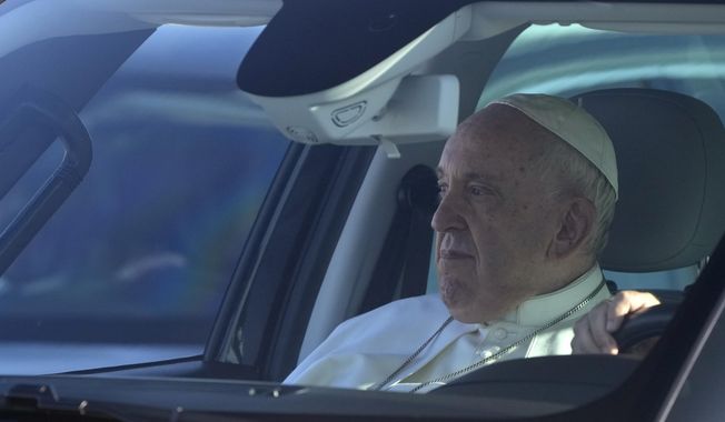 Pope Francis arrives to board his flight to Budapest at Rome&#x27;s international airport in Fiumicino, Italy, Friday, April 28, 2023. The Pope is on his way to a three-day pastoral visit to Hungary. (AP Photo/Gregorio Borgia)