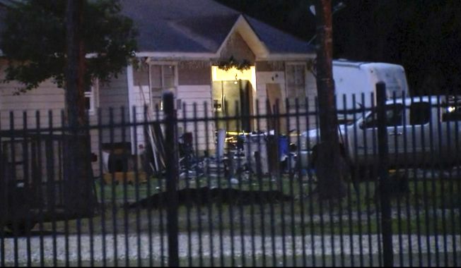 This image provided by KTRK shows the scene of a shooting early Saturday, April 29, 2023 in Cleveland, Texas. A man went next door with a rifle and began shooting his neighbors, killing several including an 8-year-old inside the house, after the family asked him to stop firing rounds in his yard because they were trying to sleep, authorities said Saturday.  (KTRK via AP)