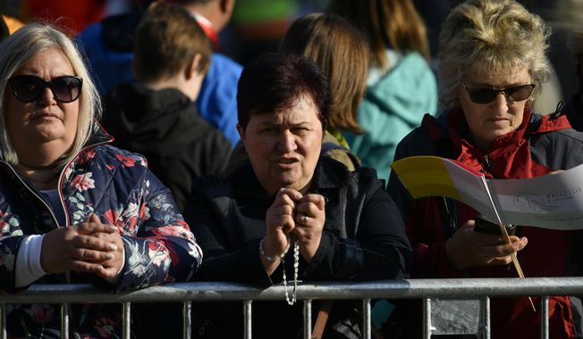 Faithful wait for Pope Francis arrival for a mass in Kossuth Lajos Square in Budapest, Hungary, Sunday, April 30, 2023. (AP Photo/Denes Erdos)