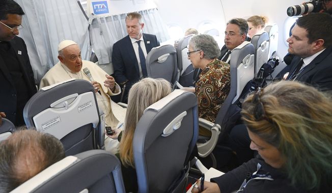 Pope Francis meets the journalists during a press conference aboard the airplane directed to Rome, at the end of his pastoral visit to Hungary, Sunday, April 30, 2023. (Vincenzo Pinto/Pool Photo Via AP)