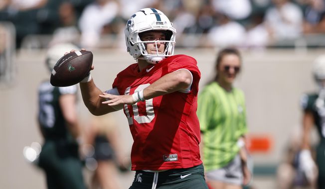 Michigan State quarterback Payton Thorne throws during an NCAA college football scrimmage, Saturday, April 15, 2023, in East Lansing, Mich. Thorne is looking for a new opportunity in college football. Team spokesman Ben Phlegar confirmed Sunday, April 30, 2023, that the two-year starter and captain has entered the portal as a graduate transfer. S(AP Photo/Al Goldis) **FILE**