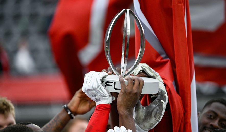 DC Defenders players hold up the 2023 North Division Champions Trophy after their 37-21 playoff win over the Seattle Sea Dragons at Audi Field, Washington, D.C., April 30, 2023. (Photo by Brian Murphy)
