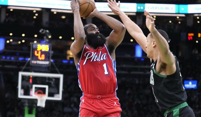 Philadelphia 76ers guard James Harden (1) shoots against Boston Celtics guard Malcolm Brogdon, right, during the first half of Game 1 in the NBA basketball Eastern Conference semifinals playoff series, Monday, May 1, 2023, in Boston. (AP Photo/Charles Krupa)
