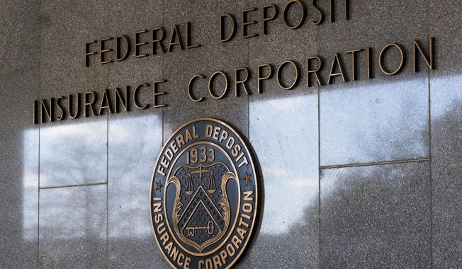 The Federal Deposit Insurance Corporation (FDIC) seal is shown outside its headquarters, March 14, 2023, in Washington. On Monday, May 1, the FDIC recommended that the U.S. rethink its decades-old policy of insuring up to $250,000 in bank deposits and replace it with an overhaul that would allow regulators to cover higher amounts on a “targeted” basis. (AP Photo/Manuel Balce Ceneta, File)