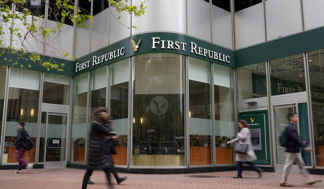 Pedestrians walk past the headquarters of First Republic Bank in San Francisco, Monday, May 1, 2023. Regulators seized the troubled bank early Monday, making it the second-largest bank failure in U.S. history, and promptly sold all of its deposits and most of its assets to JPMorgan Chase Bank in a bid to head off further banking turmoil in the U.S. (AP Photo/Godofredo A. Vásquez)